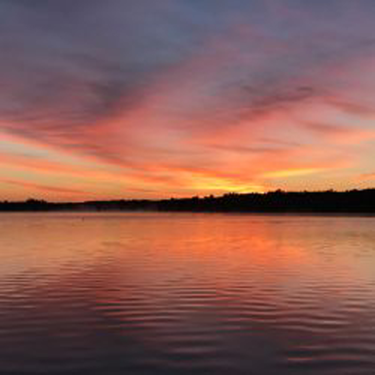 Beautiful orange and purple sunset on horizon